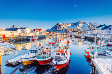 Beautiful Winter nature scene of fishing town on Lofoten Islands in Norway. Amazing sunny landscape...