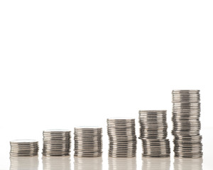 stack of coins isolated on white background incomes are rising