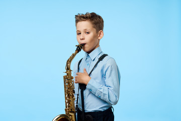 young boy with a saxophone