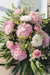wedding bouquet with rose bush, Ranunculus asiaticus as a background