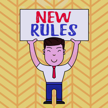 Text sign showing New Rules. Business photo showcasing A state of changing an iplemented policy for better upgrade Smiling Man Standing Holding Big Empty Placard Overhead with Both Hands