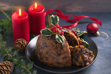 Fototapeta na wymiar Christmas pudding decorated with sprig of holly. Cristmas decorations