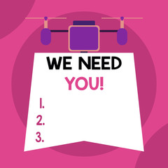 Writing note showing We Need You. Business concept for asking someone to work together for certain job or target Drone holding downwards banner. Geometrical abstract background design