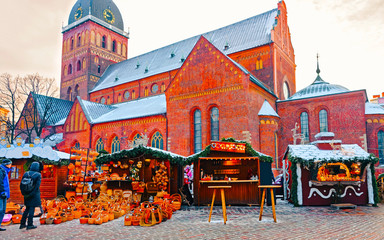 Cityscape with Christmas Market at Dome Cathedral square in Winter Riga, Latvia. Advent Fair...