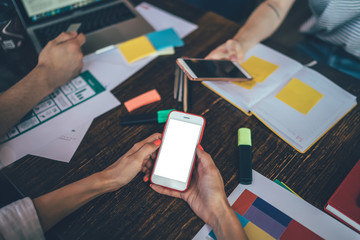 Colleagues sitting at table working in office