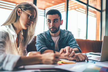 Man helping colleague with freelance job