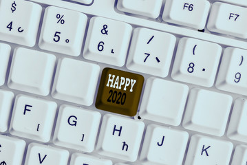 Word writing text Happy 2020. Business photo showcasing time or day at which a new calendar year begin from now White pc keyboard with empty note paper above white background key copy space
