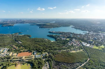 Foto op Canvas Aerial cityscape of Sydney suburbs with nature reserve park © Olga K