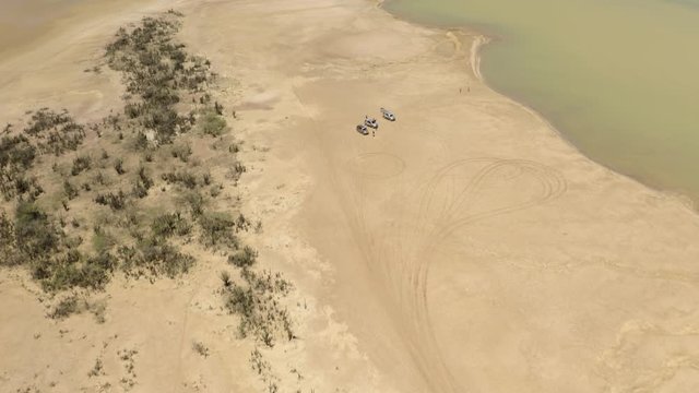 Aerial shot uf Punta Gallina lake during daytime. Uptilt 4k.