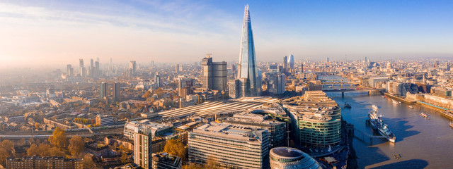 Stunning panorama view over Thames river, the Shard, the London skyline and cityscape from the skyscraper. Aerial photo over the big city. © Aerial Film Studio