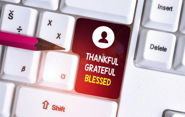 Conceptual hand writing showing Thankful Grateful Blessed. Concept meaning Appreciation gratitude good mood attitude White pc keyboard with note paper above the white background
