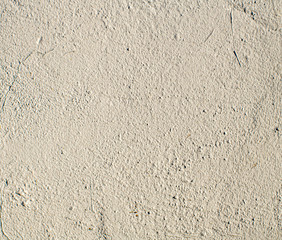 Fototapeta premium Off White Grungy Cracked Distressed Rough Cement Wall
