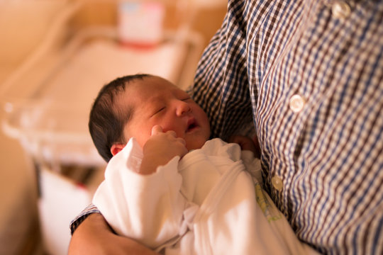 Japanese baby / held by father