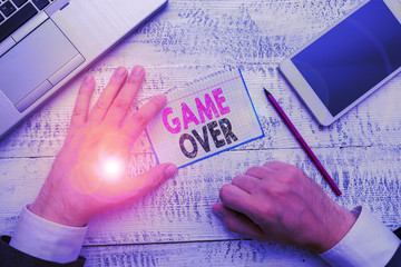 Conceptual hand writing showing Game Over. Concept meaning A situation in a particular sport that...