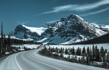 Icefields Parkway - Canada Route 93. Road in Canadian Rockies in Spring, Alberta, Canada. Cold tone.