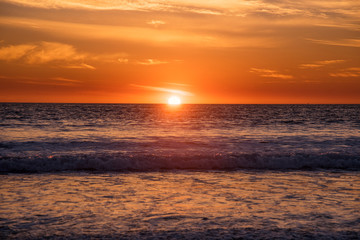 Brilliant orange sunset over the Pacific Ocean