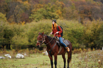 young woman riding horse