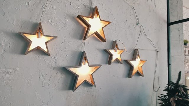 gold light stars on the white wall 