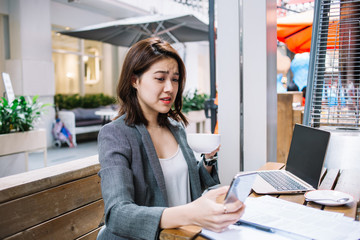 Upset remote worker browsing on smartphone