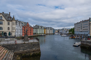 Fototapeta na wymiar Picturesque summer view of Alesund port town on the west coast of Norway, at the entrance to the Geirangerfjord. Colorful morning cityscape. Traveling concept background.