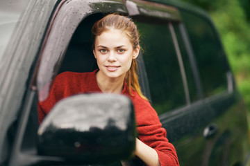 Plakat young woman in car