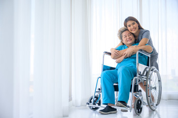 Fototapeta na wymiar Happy patient is holding caregiver for a hand while spending time together