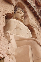 Buddha statue at Bingling Cave Temple in Yongjing, Gansu Province, China.UNESCO World heritage site.(Silk Roads: the Routes Network of Chang'an-Tianshan Corridor)