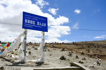 A cautionary trespassing sign marks the beginning of a Chinese military zone in Gampa Pass in Tibet...