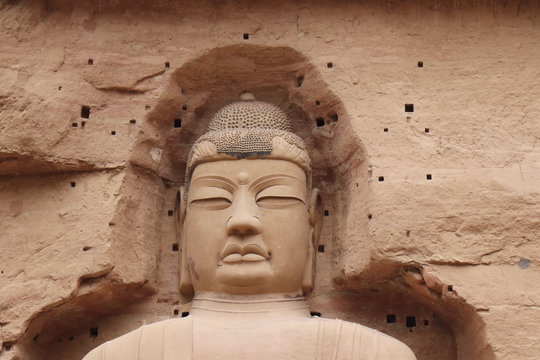 Buddha statue at Bingling Cave Temple in Yongjing, Gansu Province, China.UNESCO World heritage site.(Silk Roads: the Routes Network of Chang'an-Tianshan Corridor)