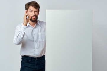 young man pointing at blank screen