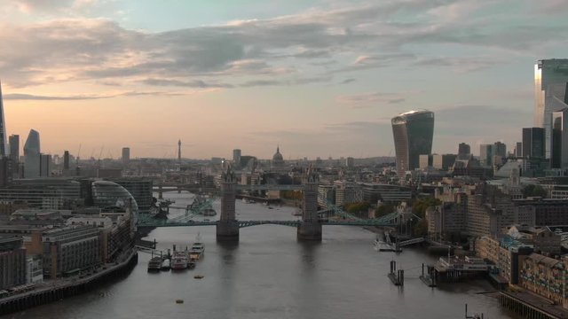 Establishing aerial view of City of London Skyline, The Shard London, Tower Bridge and Thames River beautiful sunset in London UK 