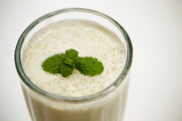 Smoothie in glass with mint leaves 