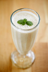 Smoothie in glass with mint leaves 