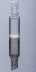 Glass medical ampoule vial for injection. Medicine is dry white drug penicillin powder or liquid with of aqueous solution in ampulla. Close up. Bottles ampule with aluminum cap on backgrounds gray.