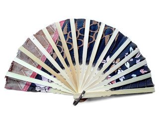 Hand fan from Bali Indonesia. Kipas Tangan Motif Batik or hand fan Batik made of bamboo and batik fabric. Hand fan patterned batik isolated on white background.