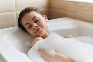 woman relaxing in bubble bath