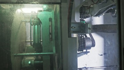 Sawmill circular saw machine. Manufacture of plastic water pipes to the factory. Process of making plastic tubes on the machine tool with the use of water and air pressure.