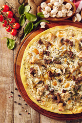 Mushroom pizza on wooden table top view