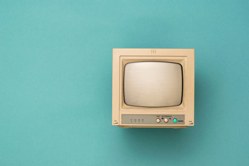 Vintage monitor with a kinescope on a blue background. Vintage electronics.
