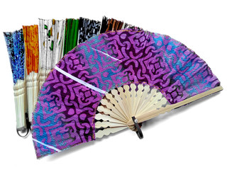 Hand fan from Bali Indonesia. Kipas Tangan Motif Batik or hand fan Batik made of bamboo and batik fabric. Hand fan patterned batik isolated on white background.