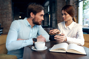 young couple having breakfast in cafe