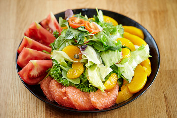 Fruits salad, peach, tangerine and pink grapefruit 