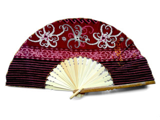 Hand fan from Bali Indonesia. Kipas Tangan Motif Batik or hand fan Batik made of bamboo and batik fabric. Hand fan patterned batik isolated on white background.