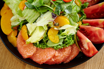 Fruits salad, peach, tangerine and pink grapefruit 