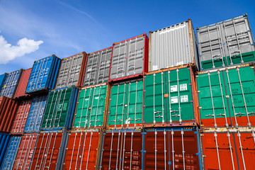 The national flag of Bulgaria on a large number of metal containers for storing goods stacked in rows on top of each other. Conception of storage of goods by importers, exporters