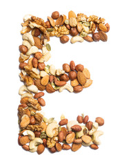 Letter E of the English alphabet from a mixture of hazelnuts, almonds, walnuts, peanuts, cashews, pumpkin seeds on a white isolated background. Food pattern made from nuts. Bright alphabet for shops.