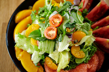 Fruits salad, peach, tangerine and pink grapefruit 