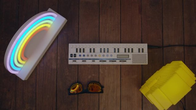 Top down view of hands playing a retro keyboard