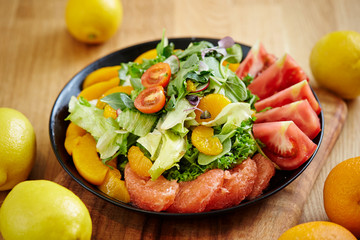 Fruits salad, peach, tangerine and pink grapefruit 