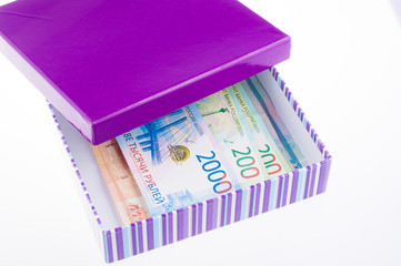 Composition with red toy car and striped box. gift concept